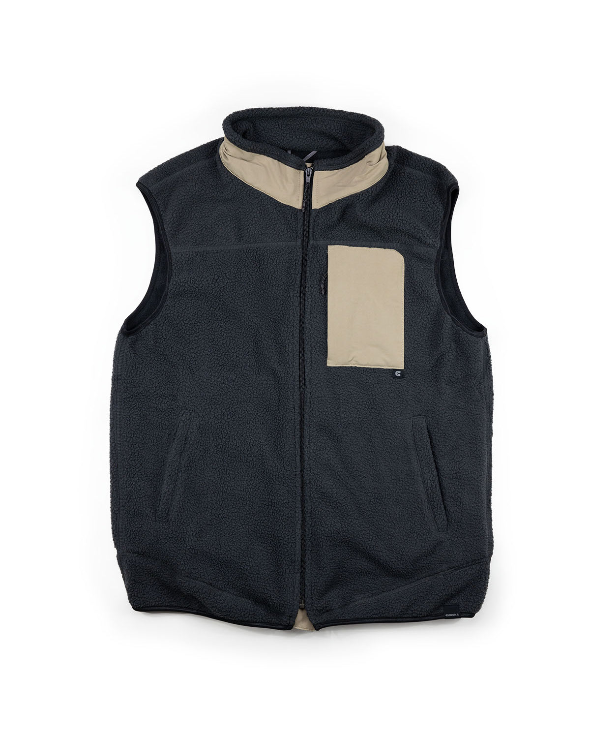 The Choona Pt. Washington Sherpa Vest is a sleeveless black high pile fleece vest with a beige collar and chest pocket, zip front, two side pockets, and water-repellent finish, shown flat on white.