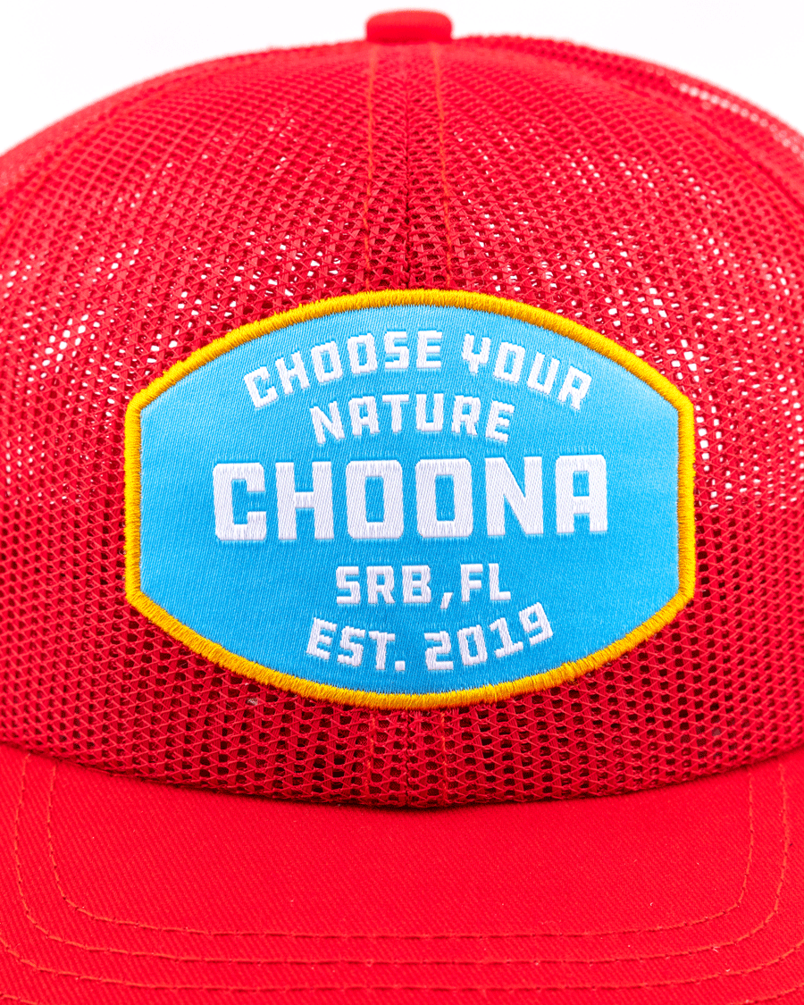 A close-up of the Breezy Snapback - Red by Choona, a mesh baseball cap with a blue and yellow patch reading CHOOSE YOUR NATURE CHOONA SRB, FL EST. 2019.