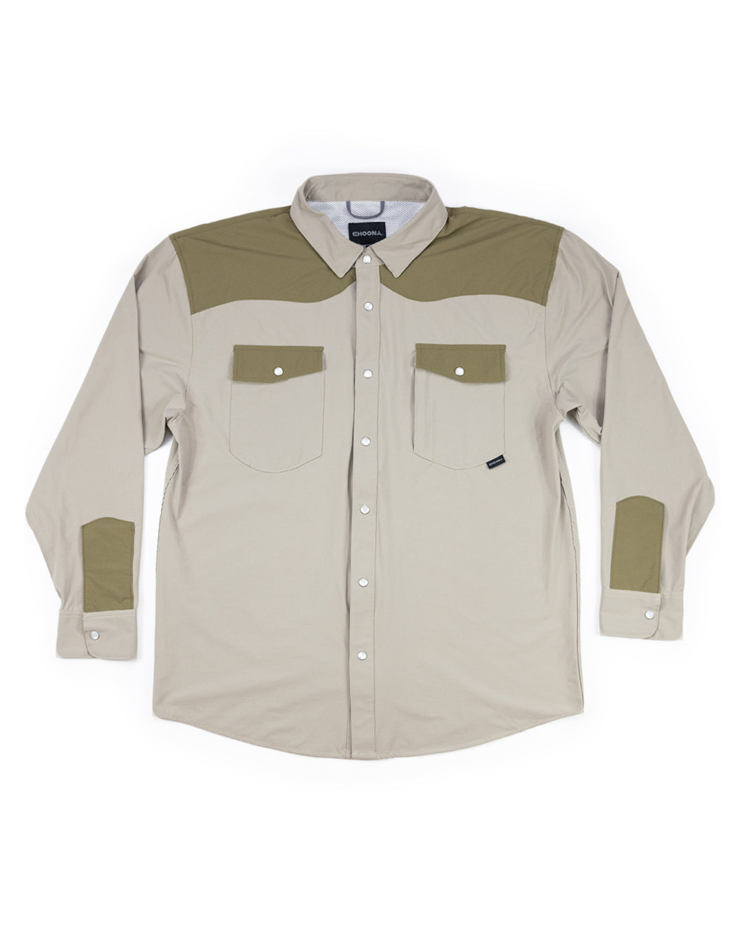 A coastal cowboy essential, the Choona Panhandle Pearl Snap features long sleeves, buttoned chest pockets, olive green panels and patches, and a pointed collar—versatile style inspired by the Florida Panhandle.