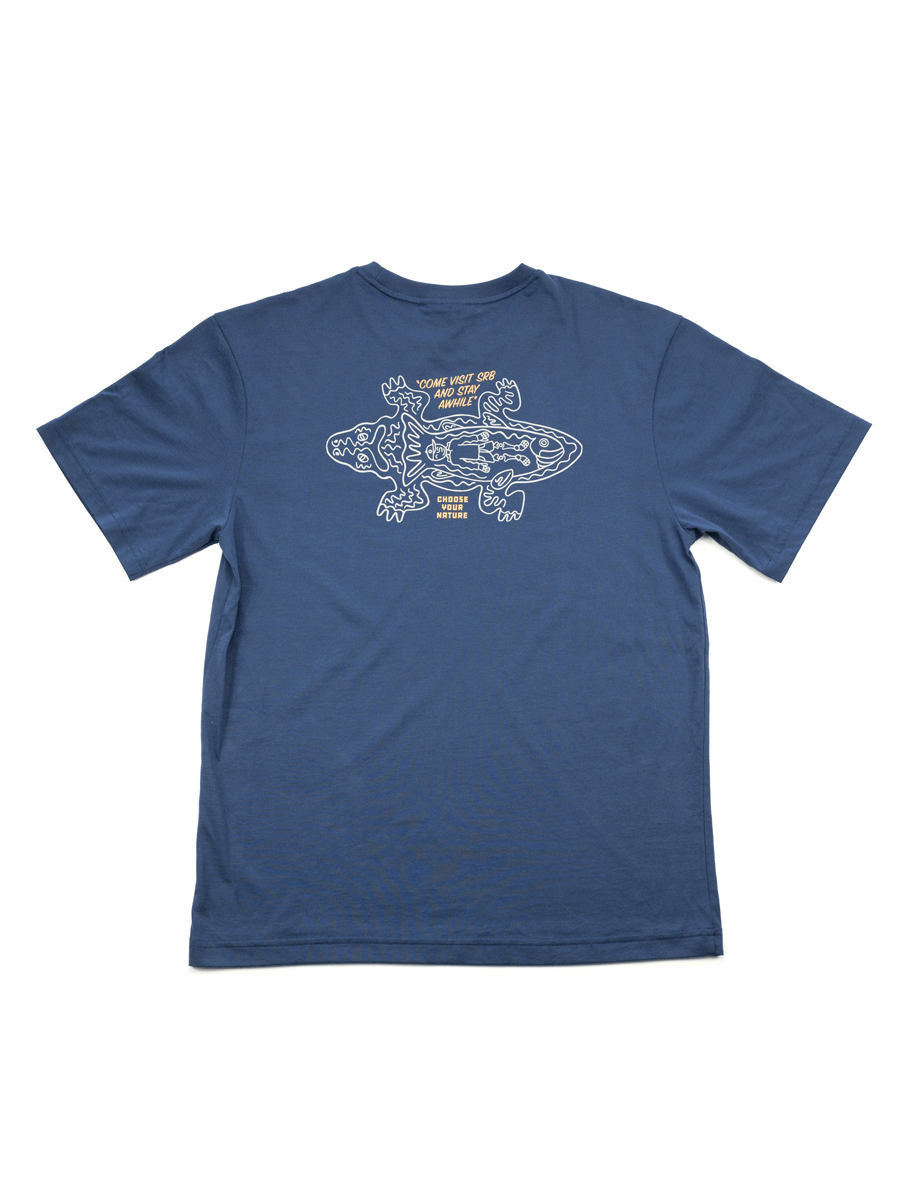 The Choona Stay Awhile Graphic Tee, made from 100% Pima Cotton, showcases a line art illustration of lizards and COME VISIT SRB AND STAY FOR A WHILE text on the back—ideal for outdoor enthusiasts.