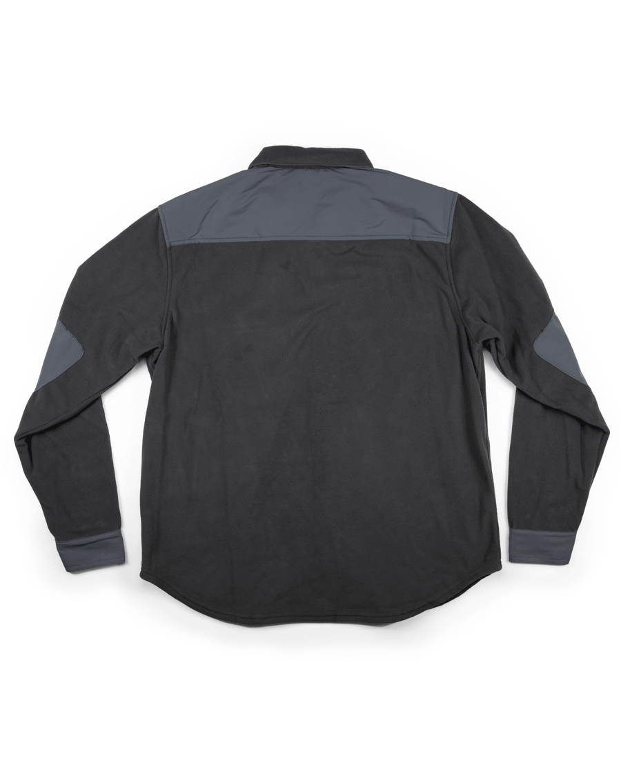 The Choona Skipper Shacket is a long-sleeve black shirt with gray shoulder, elbow, and cuff accents, made from recycled polyester for cold weather. Shown flat and photographed from the back.