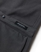 Close-up of a dark gray Skipper Shacket by Choona, crafted from recycled polyester with a snap button, pocket seam, and black label featuring “CHOONA” in white and “CHOOSE YOUR NATURE.” Ideal for cold weather.