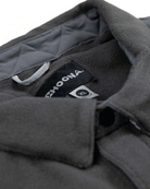 Close-up of the dark gray Skipper Shacket by Choona in size XL, showing its collar and tags against a quilted inner lining. Made from recycled polyester, its ideal for layering in cold weather.