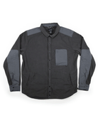 The Choona Skipper Shacket is a long-sleeved, button-up dark gray jacket with lighter gray shoulder, elbow, and chest pocket patches. Made from recycled polyester—ideal for cold weather. Shown laid flat on a white background.
