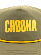 A close-up of the Choona Wavy Snapback in olive green, featuring bold yellow CHOONA lettering on the front and crafted with quick-drying fabric for coastal adventures.