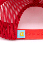 Close-up of the back of Choona’s Breezy Snapback - Red, featuring a mesh body, adjustable snap closure, and a small blue tag with a yellow C sewn near the clasp.