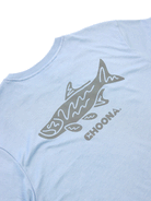 The Choona Tarpon Graphic Tee features a light blue color, a stylized fish and CHOONA in gray screen-printed on the back, and is crafted from 100% Pima Cotton for superior comfort.