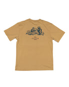 The SRB Natives Graphic Tee by Choona is a tan short-sleeve shirt made from soft Pima Cotton, featuring dark blue line art of a bear and alligator pointing weapons at one another in the desert, above the words SRB NATIVES—ideal for Santa Rosa Beach adventures.
