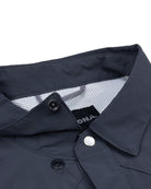 Close-up of the collar and upper buttons of the Choona Panhandle Pearl Snap, showing its white snap button, black inner tag, and mesh-like lining—ideal for nailing that coastal cowboy style from the Florida Panhandle.