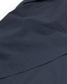 Close-up of dark navy blue fabric from the Choona Panhandle Pearl Snap, featuring a horizontal seam, smooth texture, and neat stitching—ideal for channeling coastal cowboy style inspired by the Florida Panhandle.