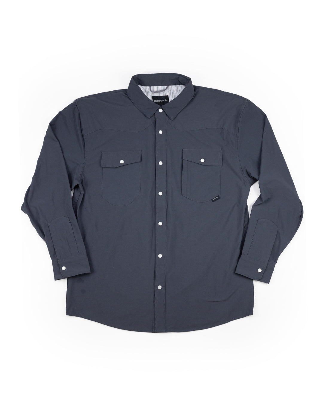 The Choona Panhandle Pearl Snap is a long-sleeve, dark gray shirt with a collar and two front chest pockets, each with a button. Laid flat on a white background, its perfect for the coastal cowboy look.